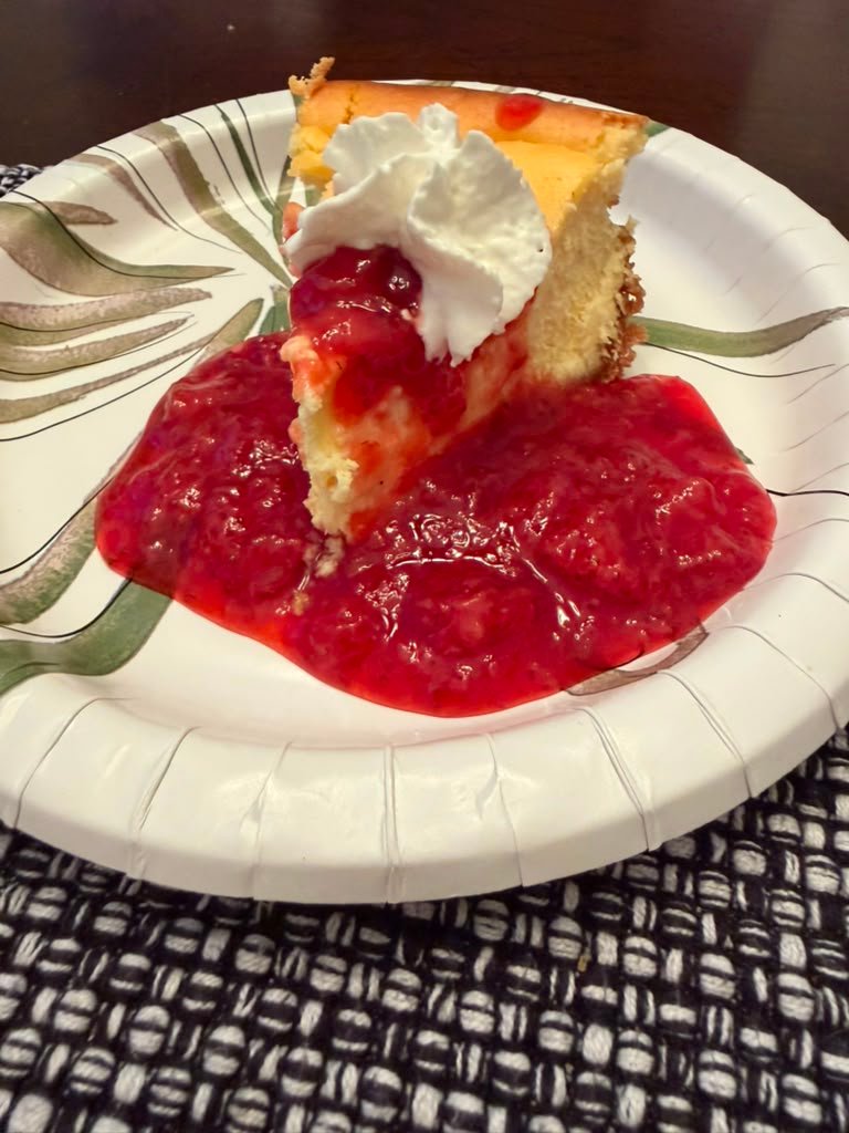 Homemade strawberry cheesecake with strawberry sauce made by Anissa
